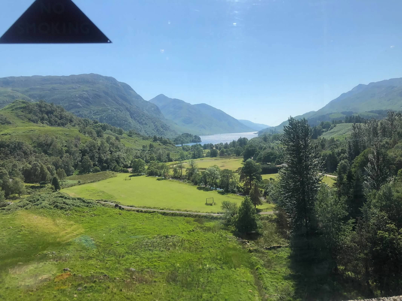 Scottish Highland With Lake Background