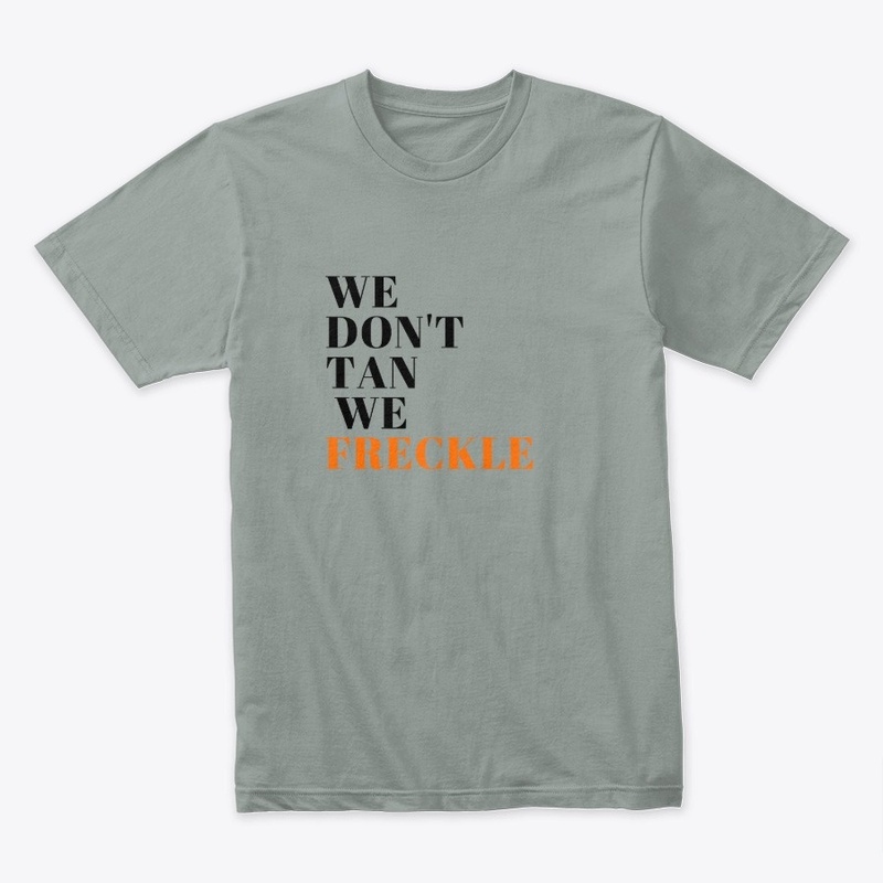 We don't tan we freckle - slogan T-shirt