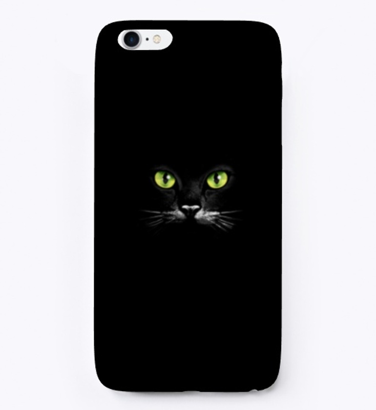 Green eyes of a black cat