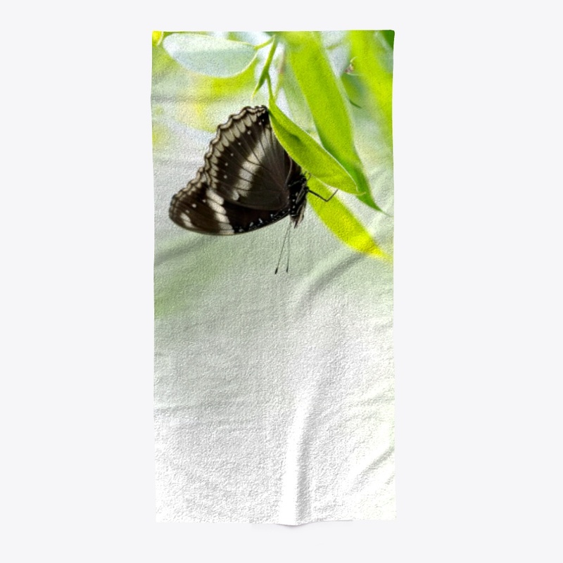 N-115 BLACK BUTTERFLY ON GREEN LEAF