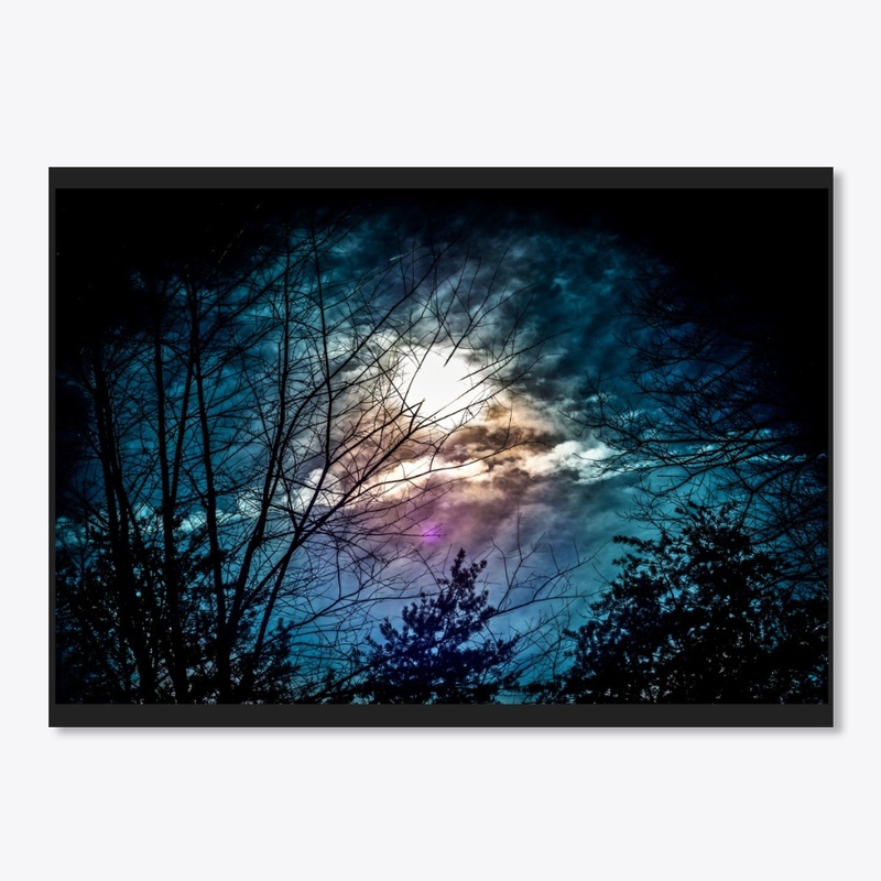 glowing moon behind clouds at night