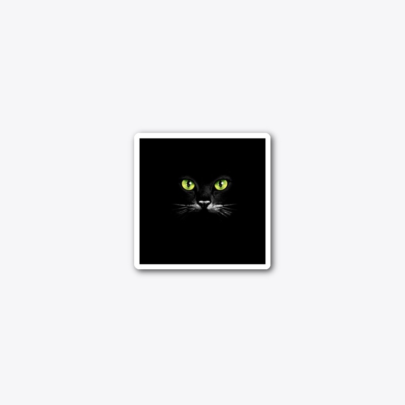Green eyes of a black cat