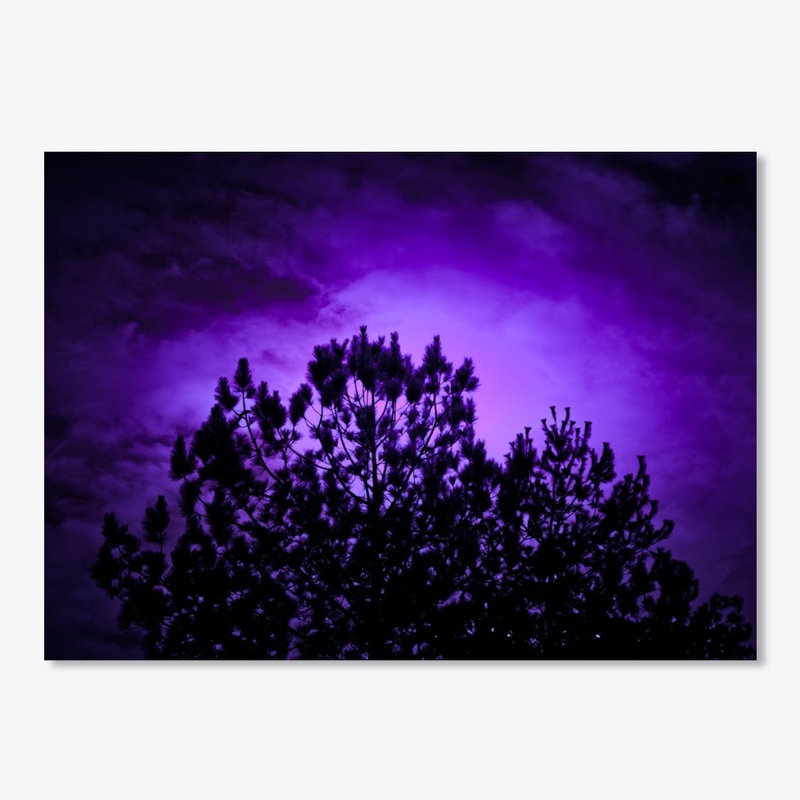 purple glowing moon behind tree