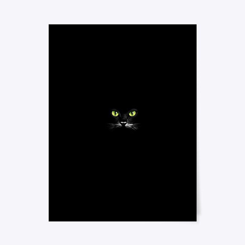Green eyes of a black cat