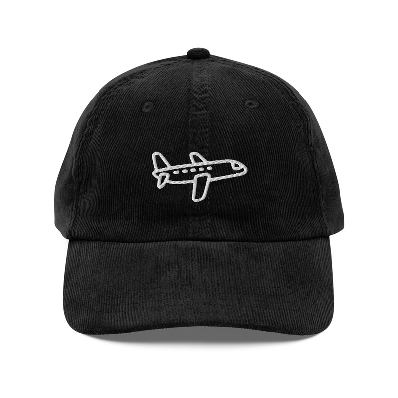 A black color cap with a airplane design